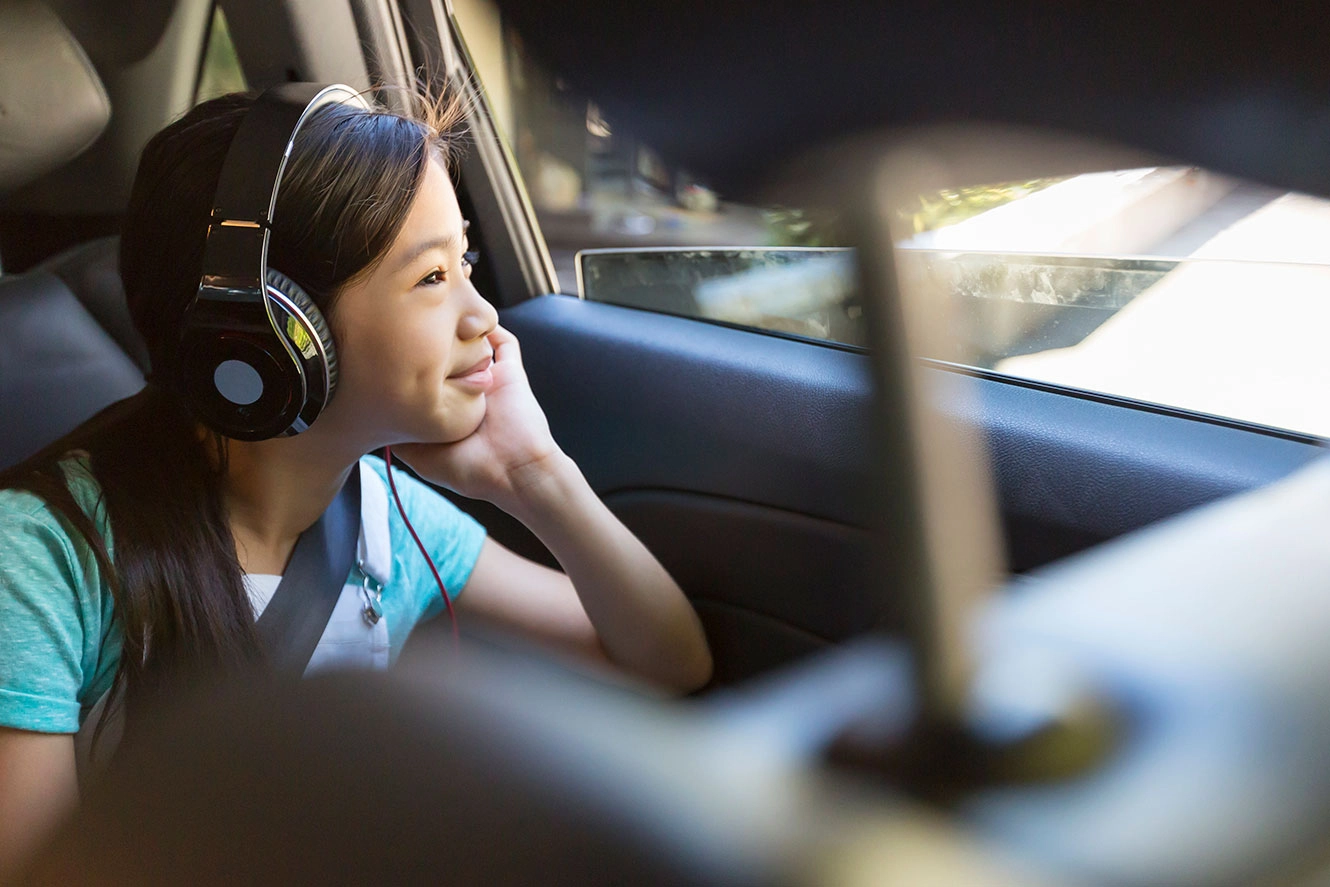 a young girl wearing headphones